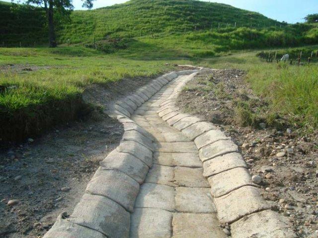 Protection of channels in soil-cement bags 